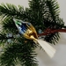 Glasvogel mit Glasschwanz, mattsilber-gold-blau, gr&uuml;ner Kopf