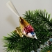 Glasvogel mit Glasschwanz, mattsilber-gold-rot,m.blauen Kopf