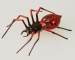 Spinne rot mit Einschmelzungen