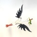 Storch mit Frosch hängend